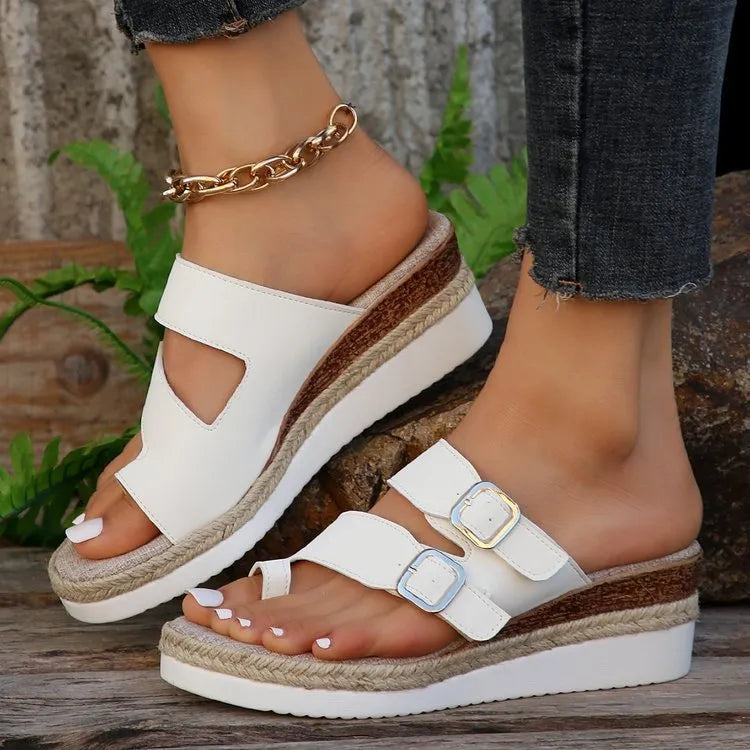 White patent leather wedge sandals with woven upper and finger-fit toe separation design