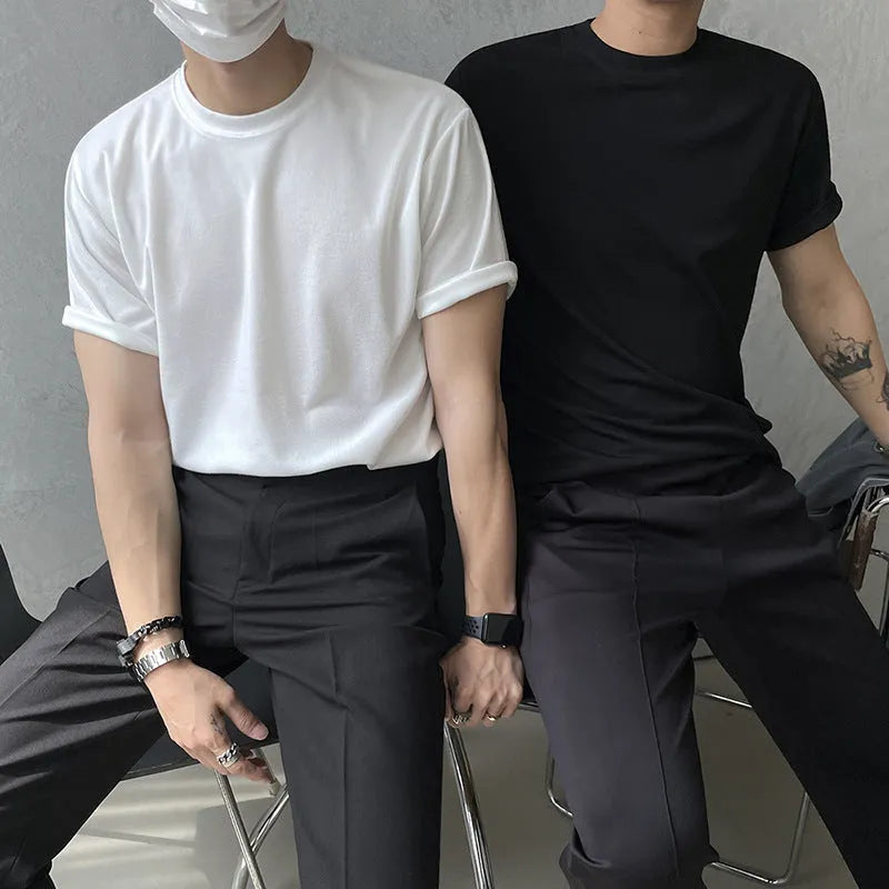 Men's slim fit cotton t-shirt in black, showing round neck and half-sleeve design.