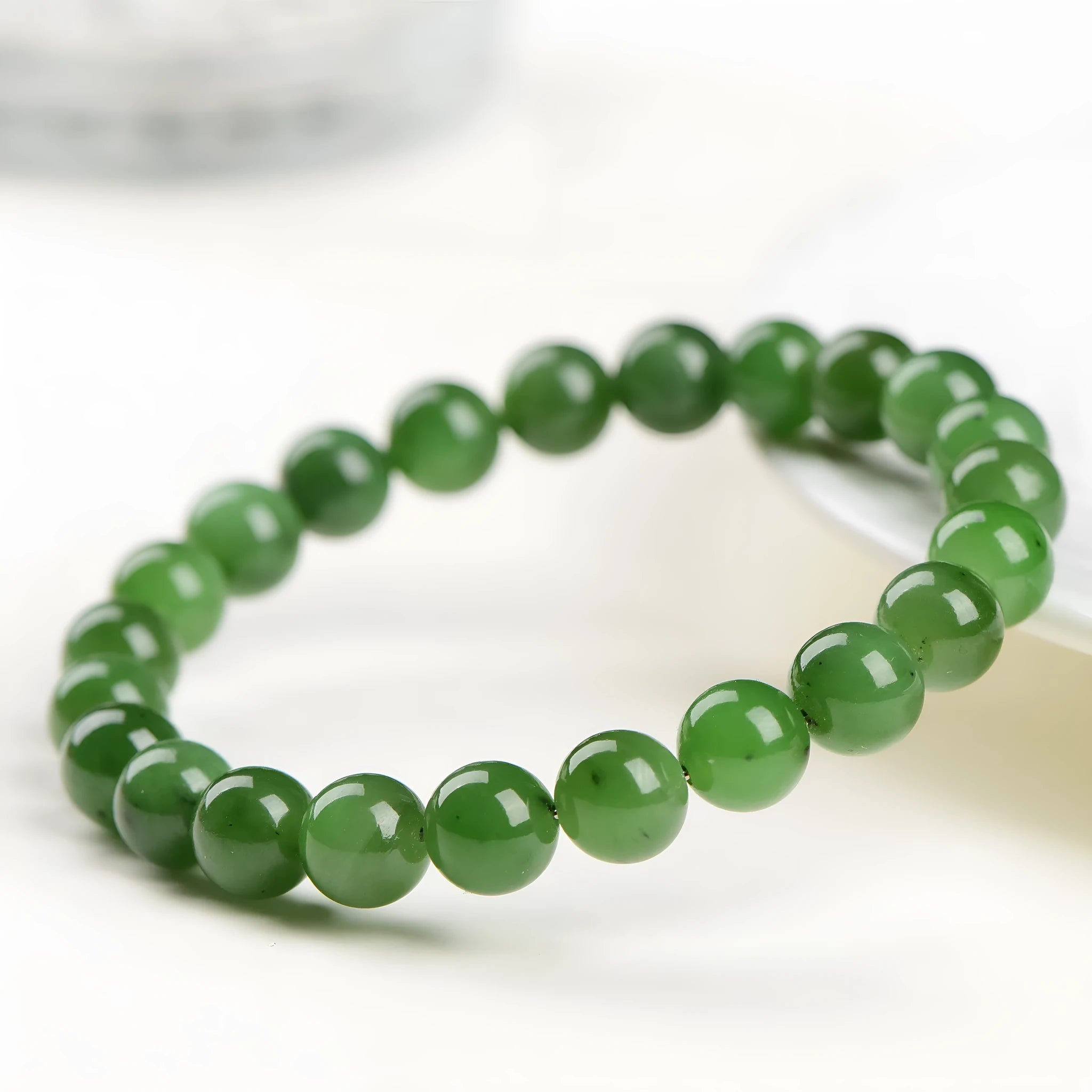 Natural Jasper ball bracelet with polished Hetian jade beads in various size options.