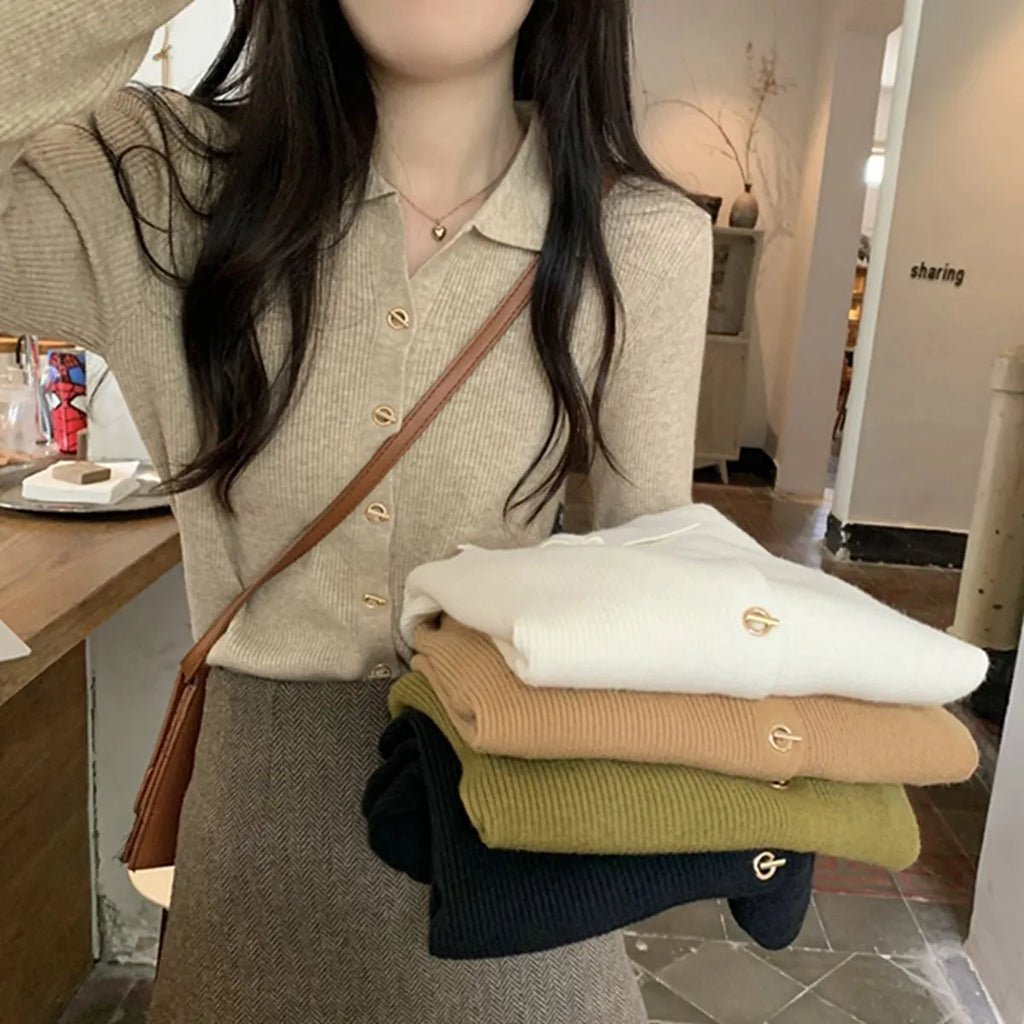 Loose-fitting knitted cardigan in viscose fibre showing long sleeves and neutral colour options