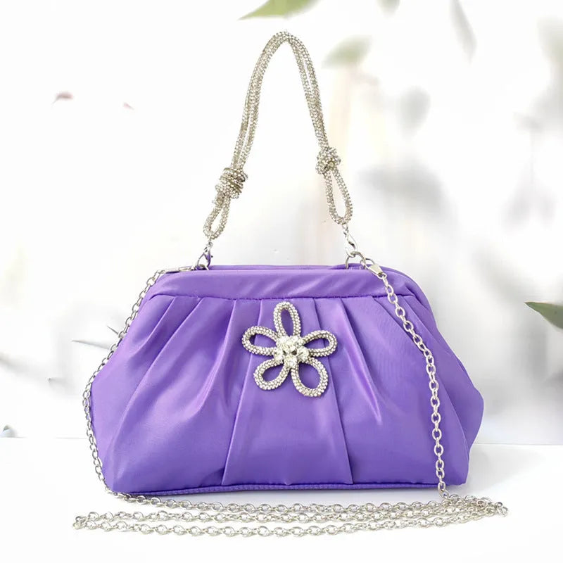 Women's large black polyester dinner bag with chain accents and document compartment, shown with rose red and lavender purple colour options