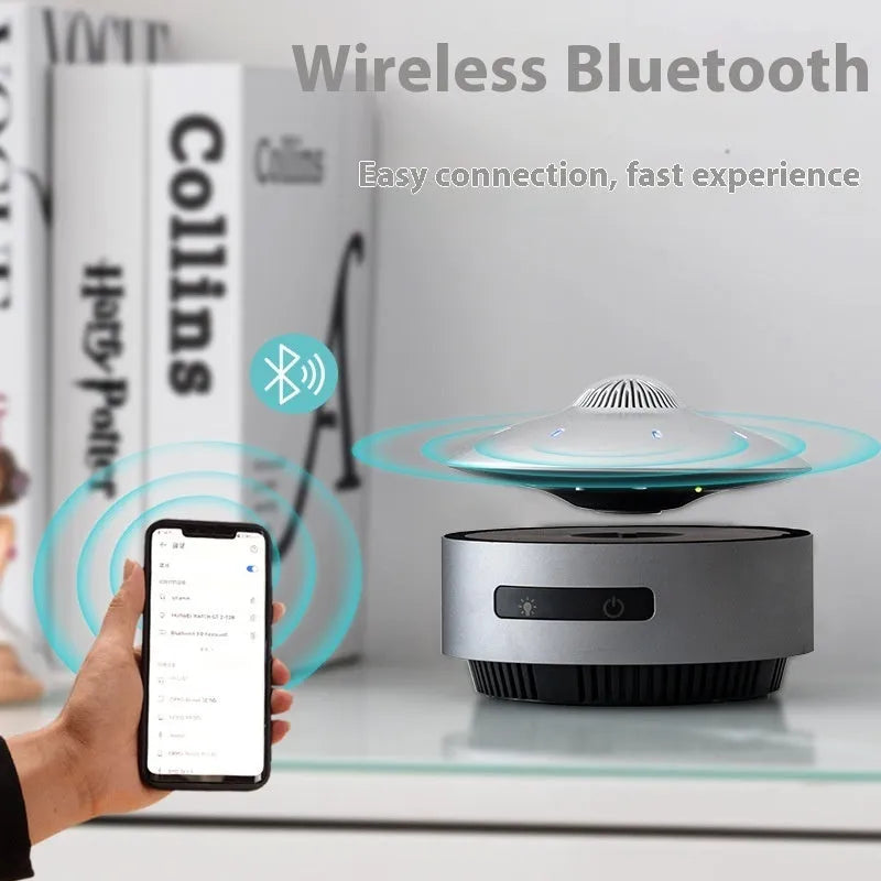 Black magnetic levitation Bluetooth speaker floating above base with automatic lifting mechanism