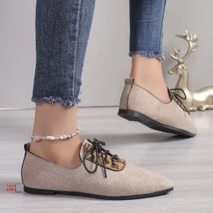 Beige leopard print women's pointed toe high heel pumps with a rubber sole.