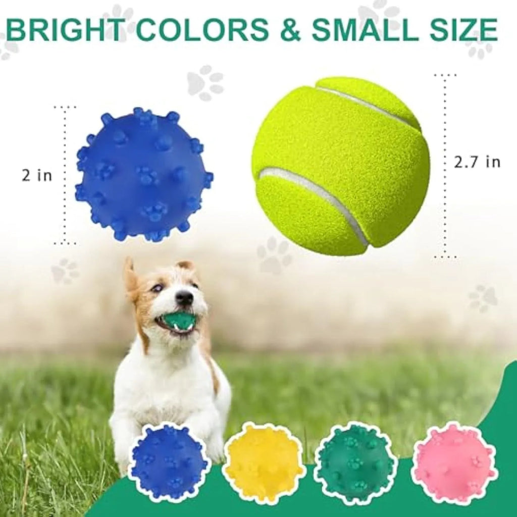 Blue, green, pink, and yellow 2-inch dog balls with spiked dimple texture on grass.