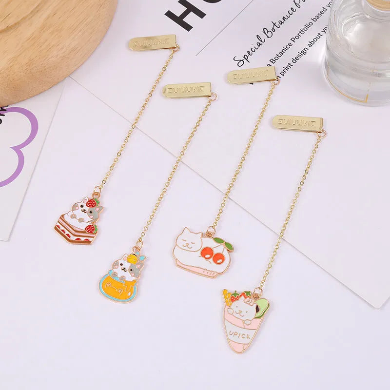 Jane Key Foodie Cute Pet Cat metal bookmark with cartoon pendant, shown in various colour designs.