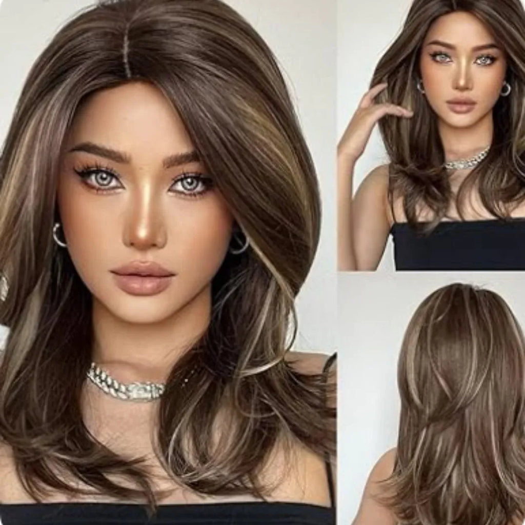 Mid-length curly synthetic wig with gradient colour and long bangs on a wig stand.