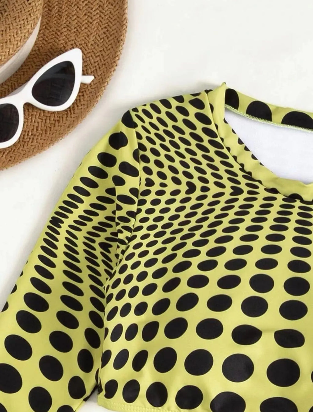 Women's green polka dot swimsuit three-piece set showing halterneck top and skirt