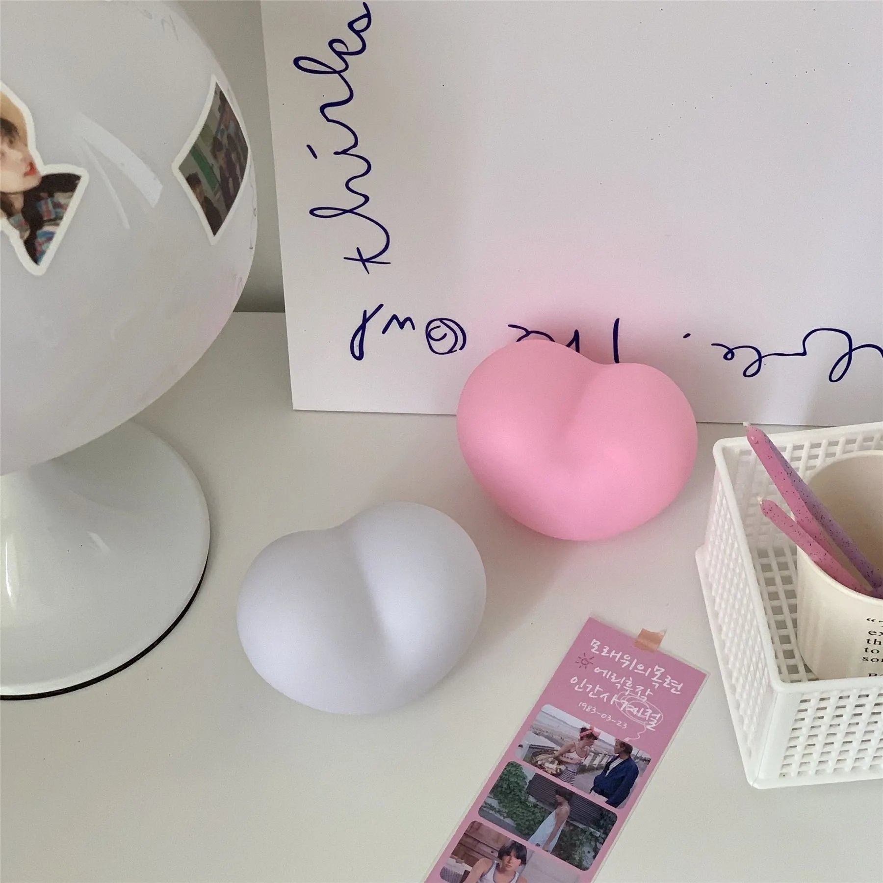 Vinyl atmosphere lamp in pink and white colours showing small and large size options for decorative ambient lighting