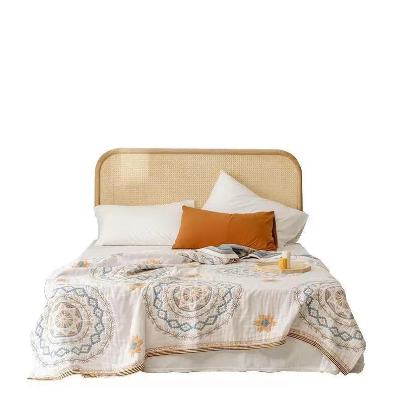 Geometric patterned cotton towel blanket laid flat, showing its modern design and soft texture.