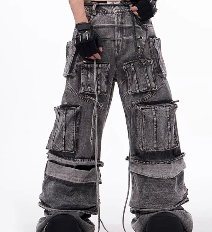 Grey distressed denim men's overalls with rope stitching detail on the front