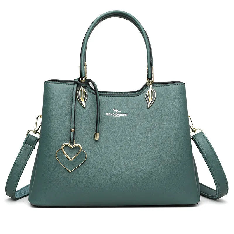 Women's black PU leather messenger bag with shoulder strap and sewing thread detailing
