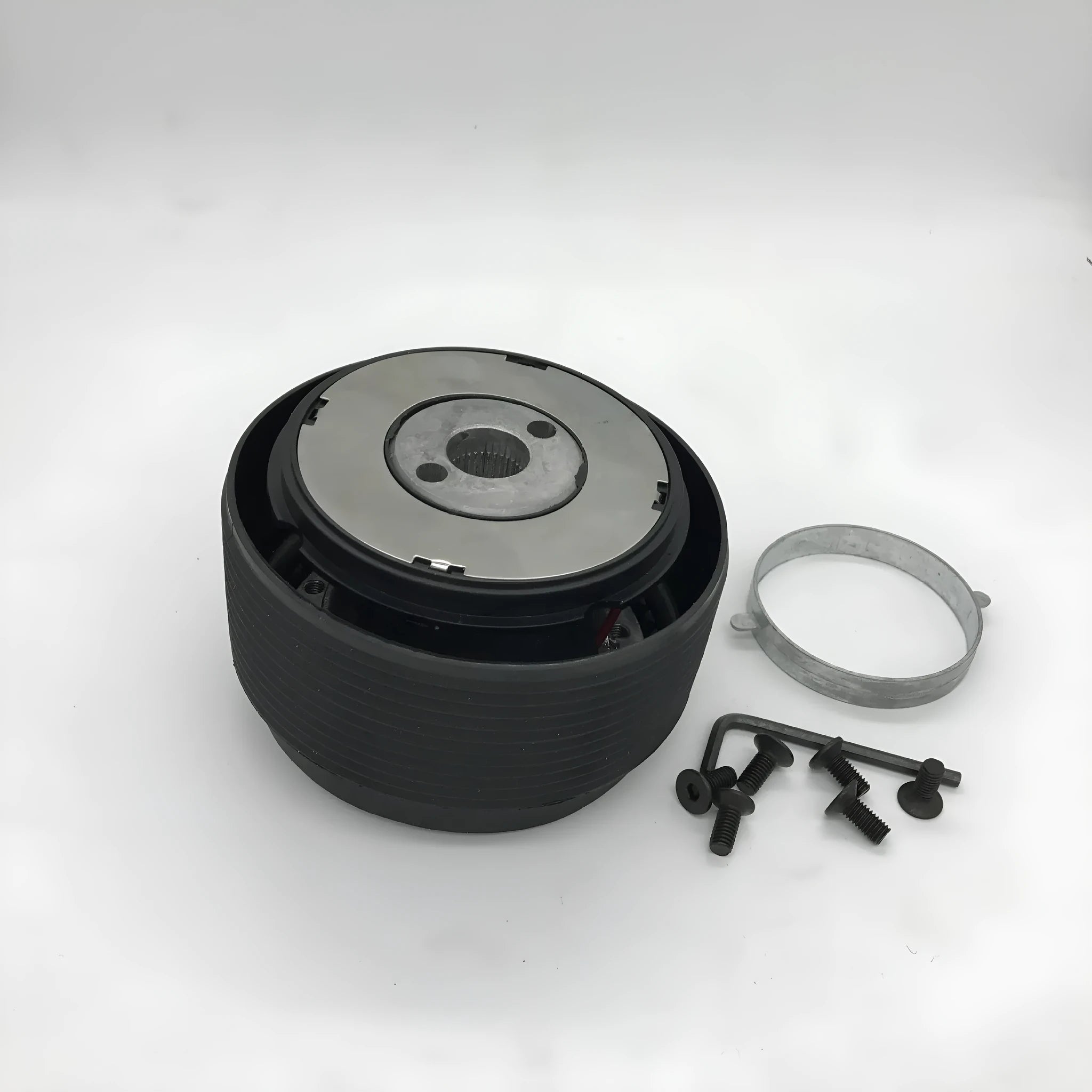 Black plastic and aluminium steering wheel connector hub adapter for Mazda R-2 model