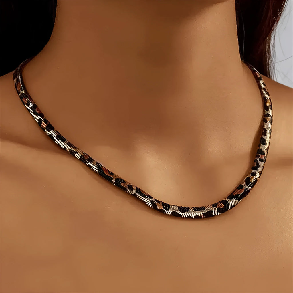 Women's alloy leopard necklace with leopard print motif against a neutral background