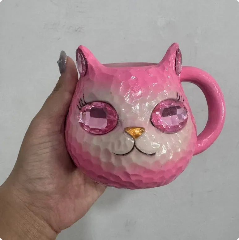Resin crystal earth cat cup craft ornament in American style, shown in blue, green, pink, and purple colour options.