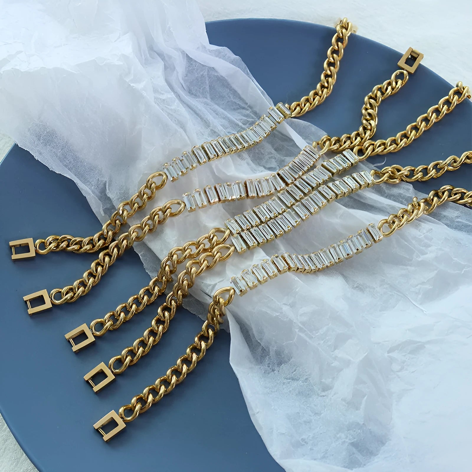 Gold titanium steel geometric matte finish unisex bracelet on flat surface