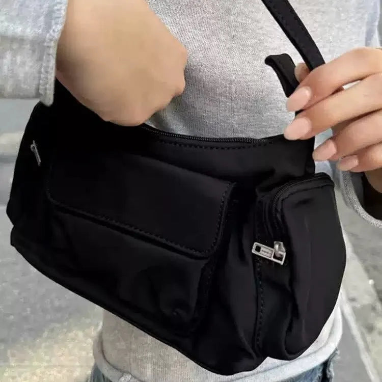 Black PU women's shoulder bag with double pockets showing side line detail, 24cm length