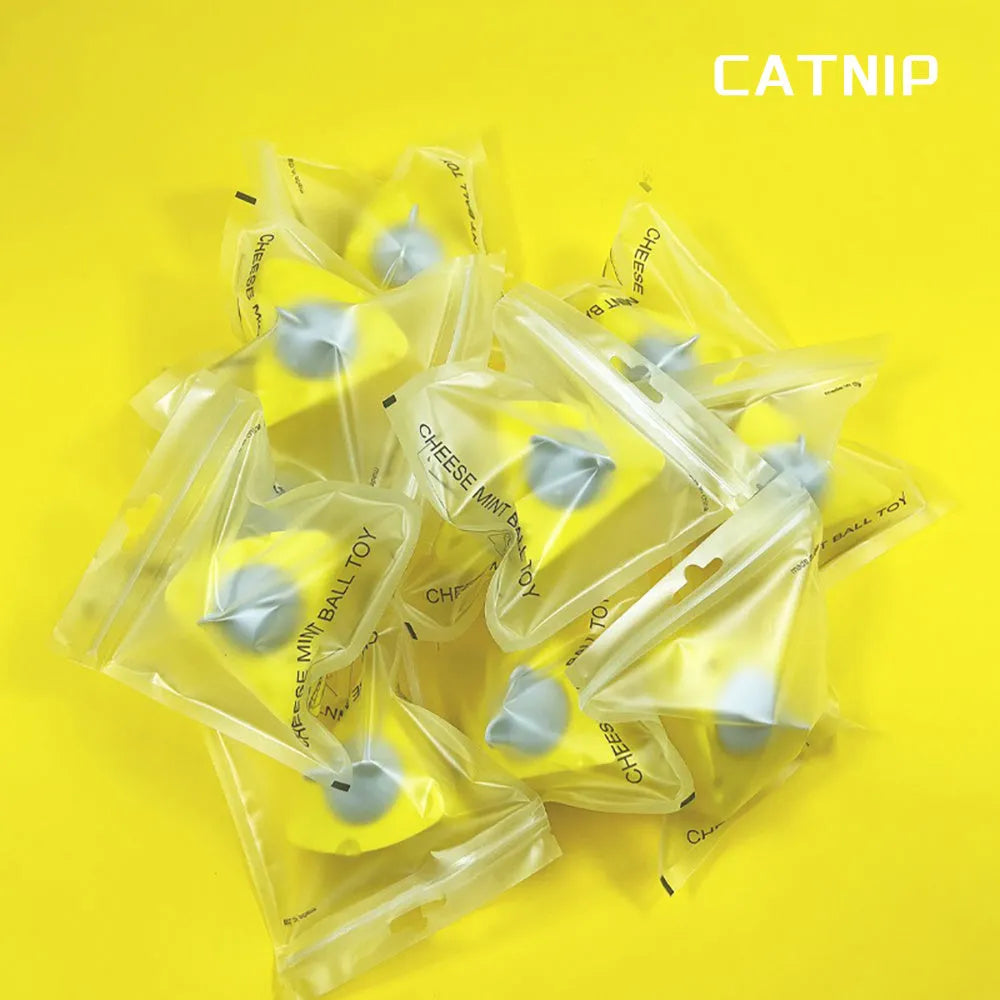 Yellow cheese-shaped catnip toy balls with silvervine chew sticks for cats
