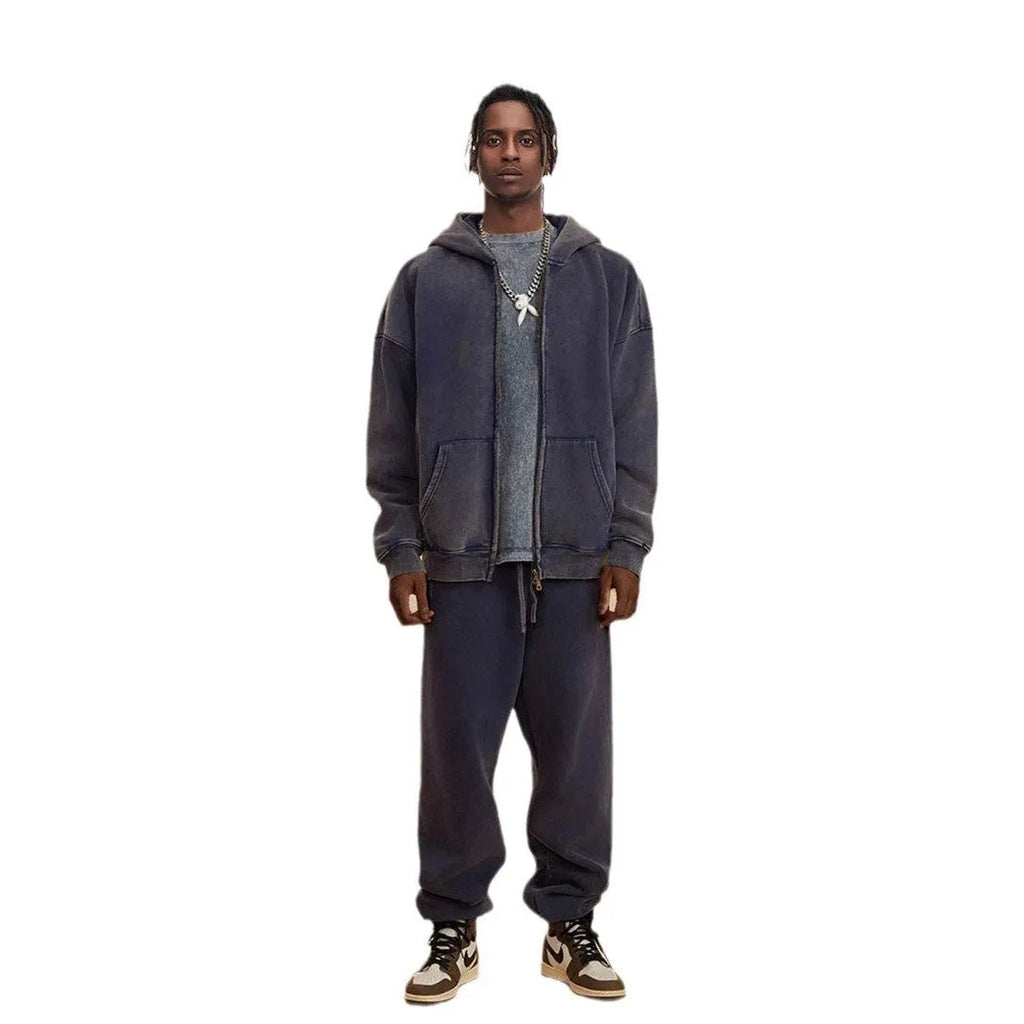 Man's washed cotton hooded cardigan with fleece lining and a double front zipper.