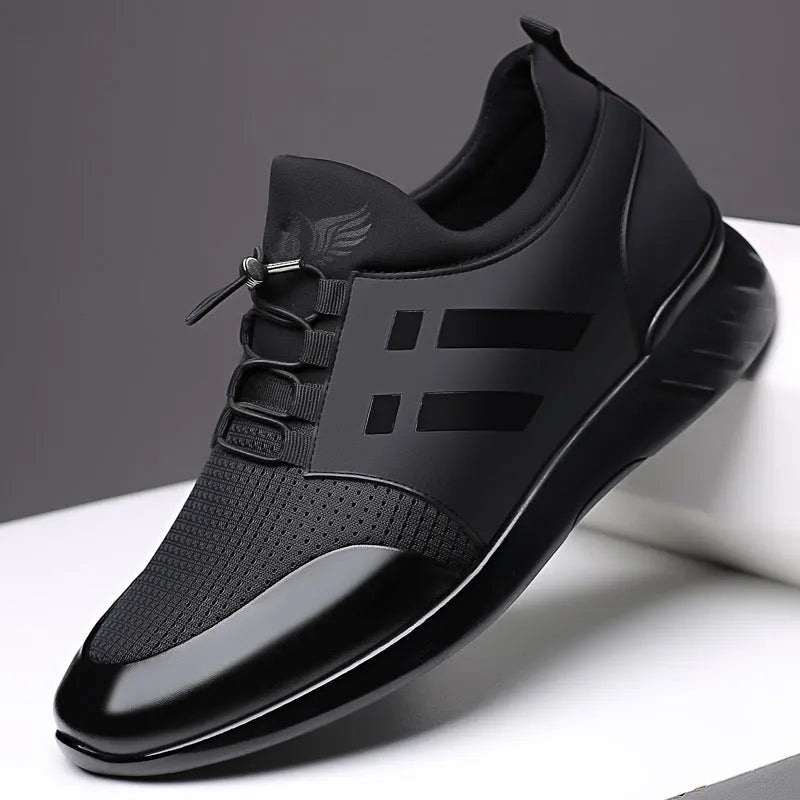 Men's black height increasing casual sneakers with chunky rubber sole and low top design.