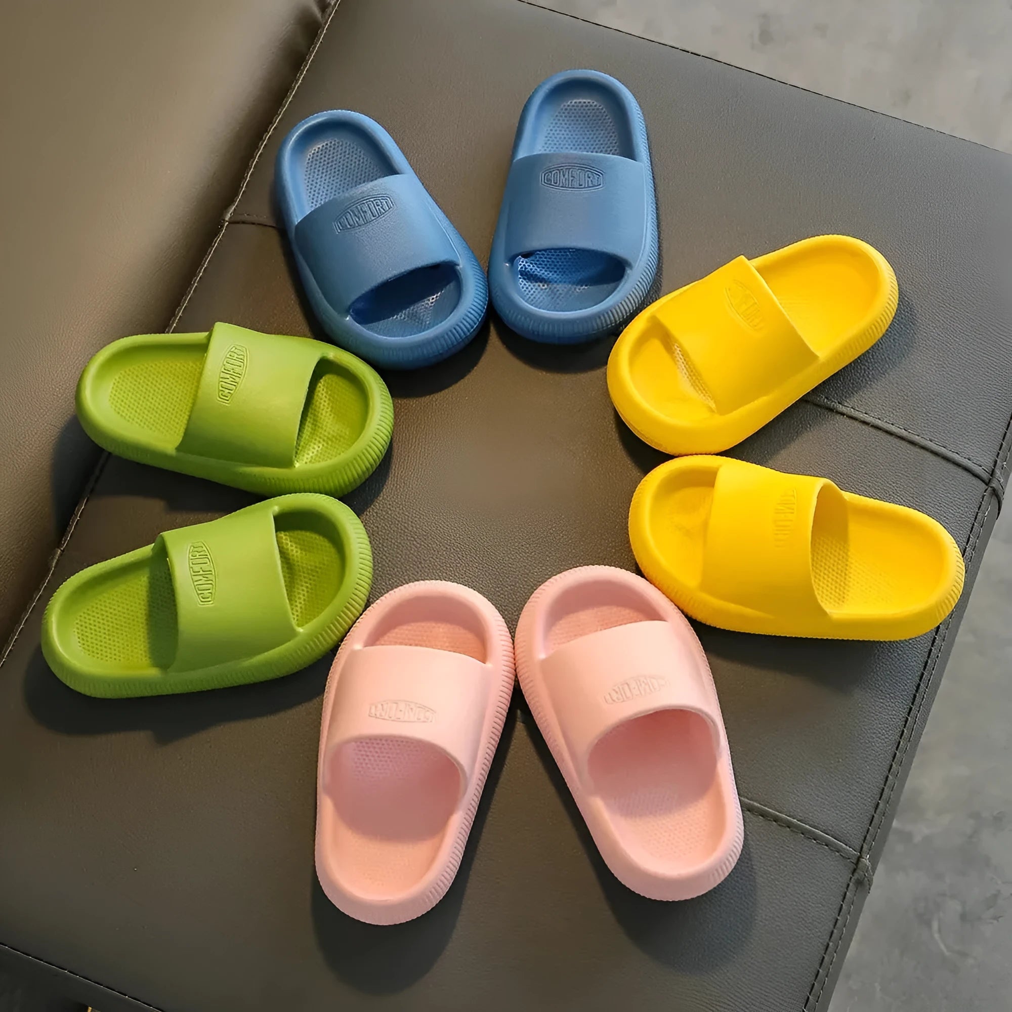 Children's EVA slippers in bright colours with non-slip soles, showing size options from 15.5cm to 21.5cm