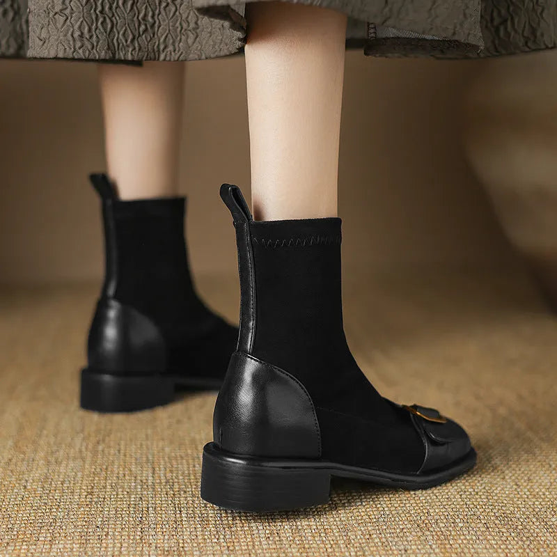 Black women's low heel Martin boots with front lace-up and decorative belt buckle stitching on a round toe.