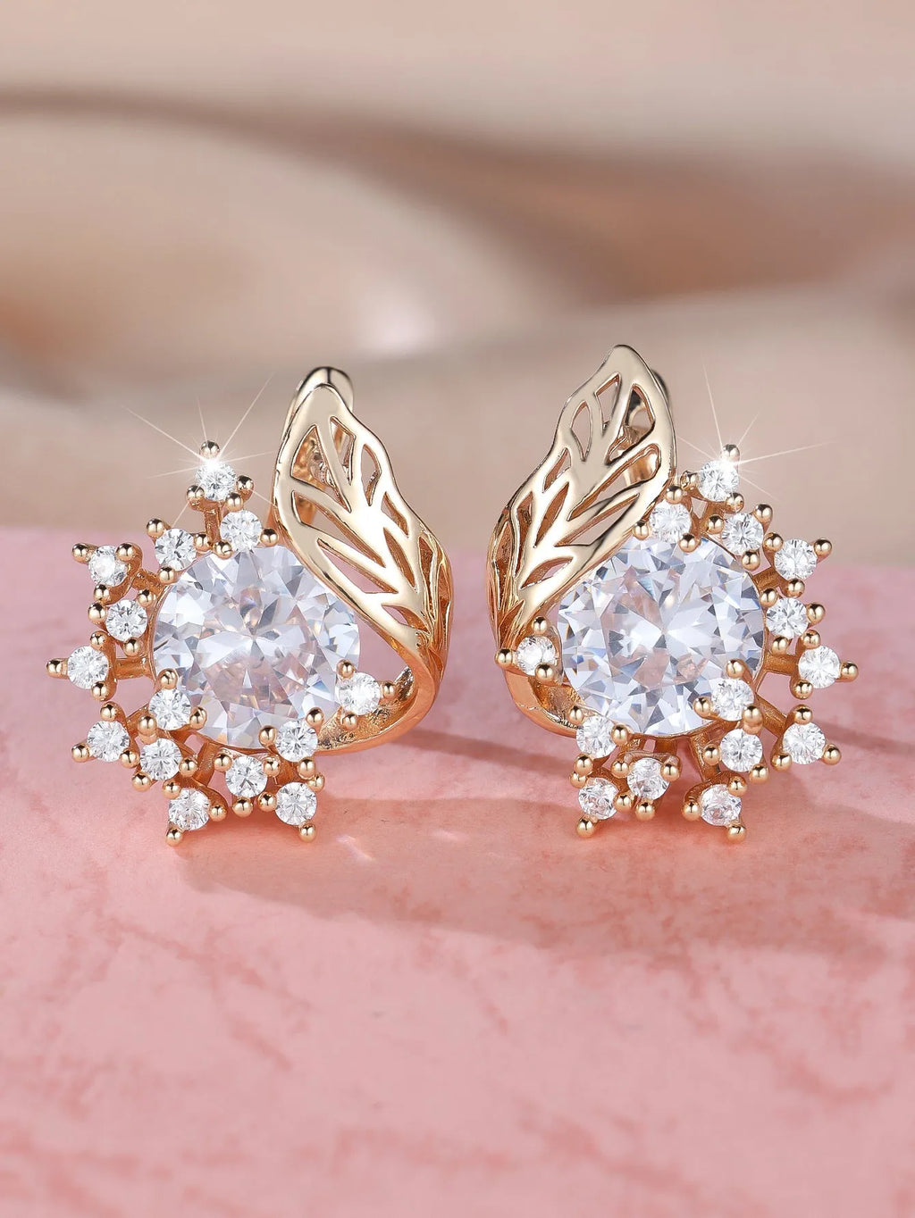 Round floral earrings with feather zircon arrangement in champagne gold with six diamond colour options
