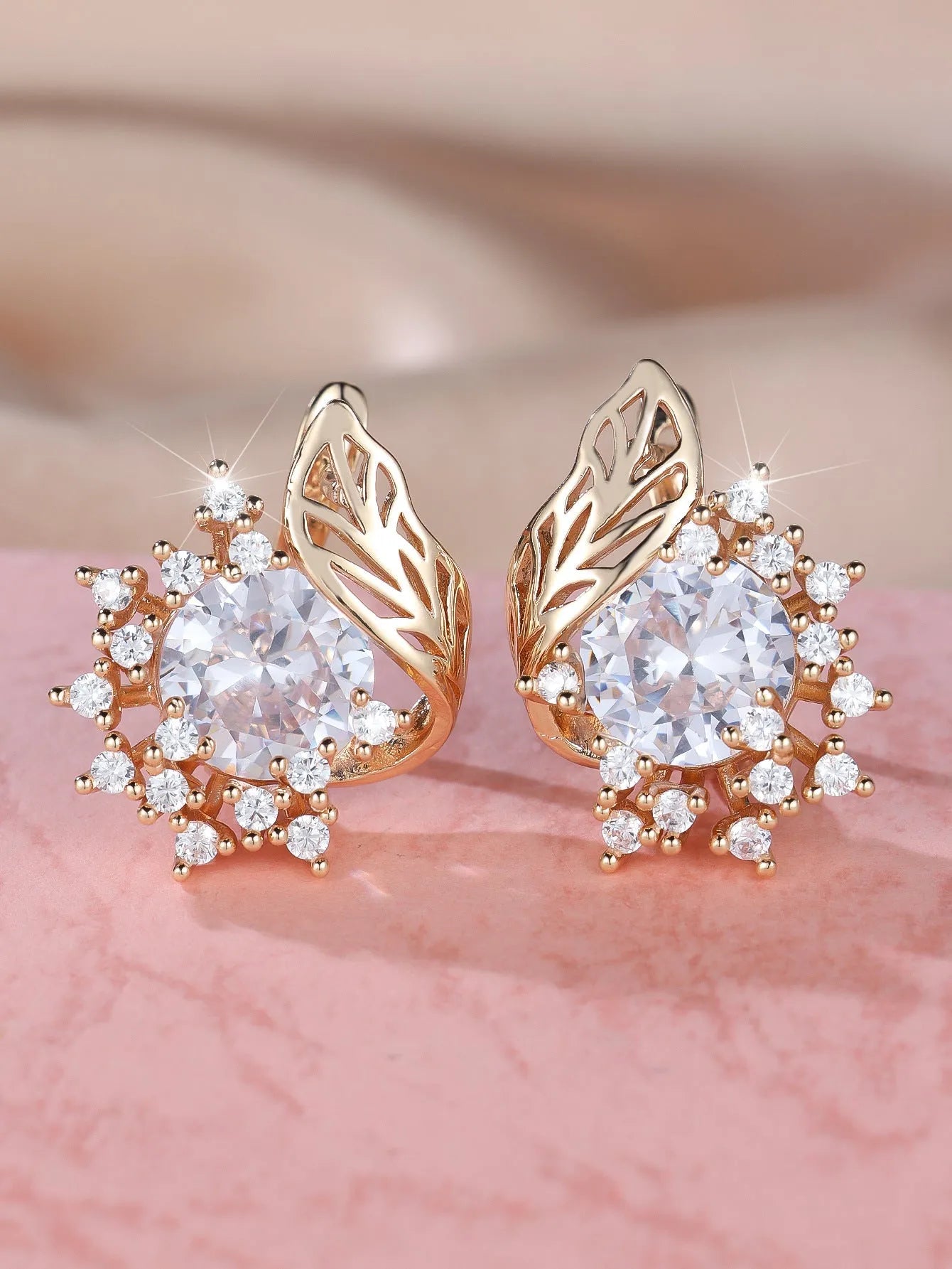 Round floral earrings with feather zircon arrangement in champagne gold with six diamond colour options