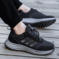 Men's and women's breathable mesh slip-on sneaker in black on a light background.