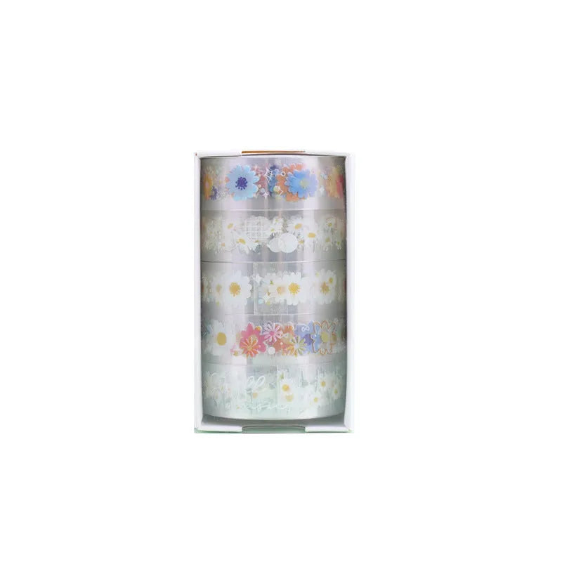 Five rolls of transparent adhesive tape with colourful daisy decoration on clear PET polyester backing
