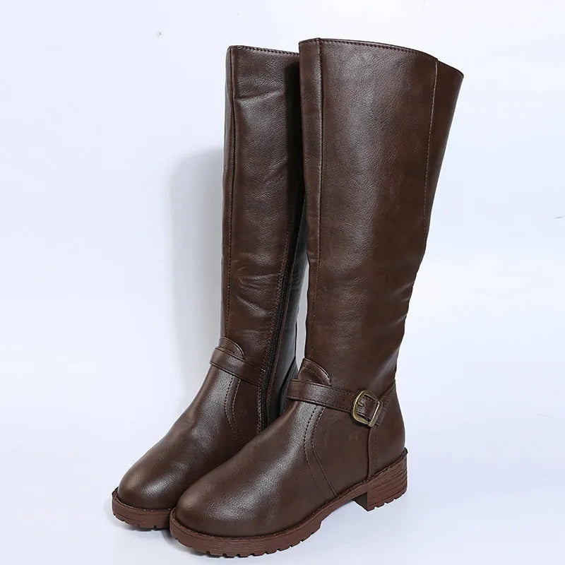 Women's knee-high knight boots in black with a square heel and a silver belt buckle detail on the side.