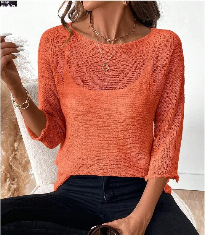 Women's off-shoulder knitted top in light blue with 3D pattern and 3/4 sleeves.