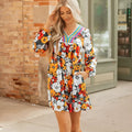 Orange floral print women's mini dress with striped lace detailing, V-neck, and long sleeves.