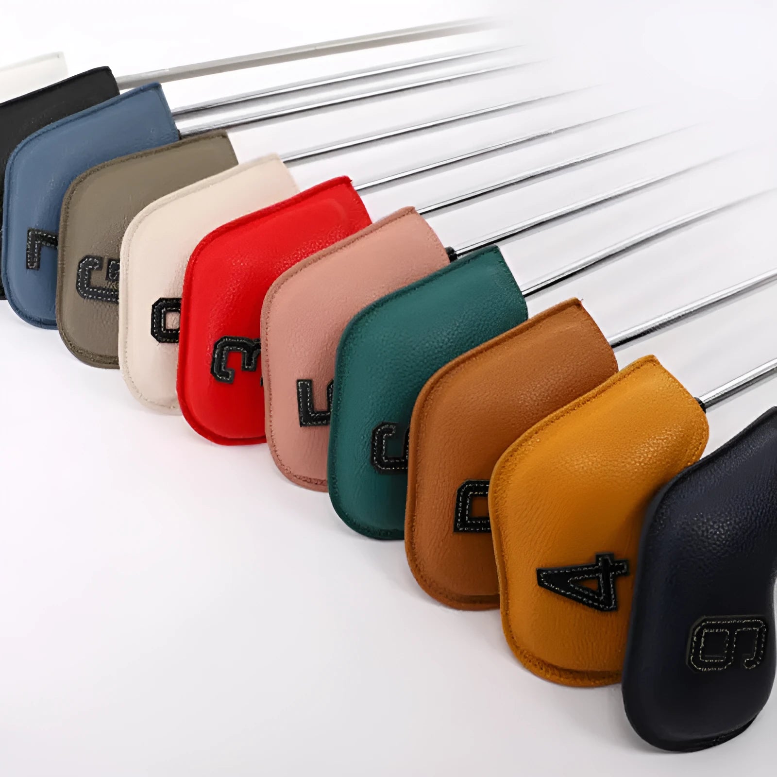 Set of 10 assorted digitally printed PU golf club head covers on a golf bag.