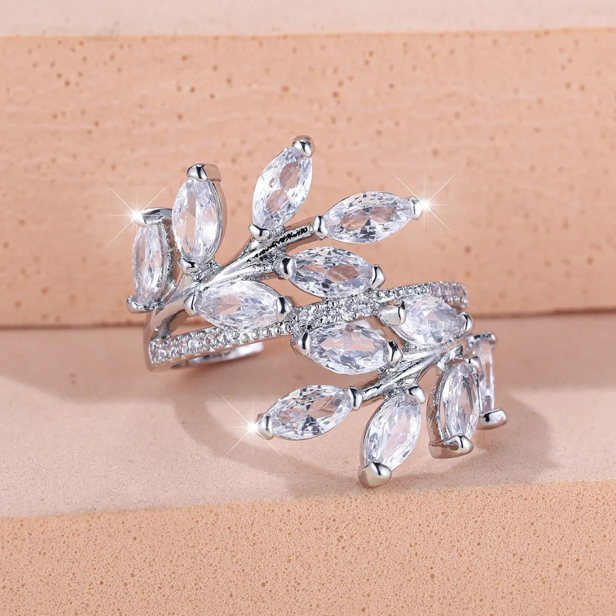 Adjustable copper leaf-shaped fashion ring with a central horse eye zircon stone in a rose gold finish.