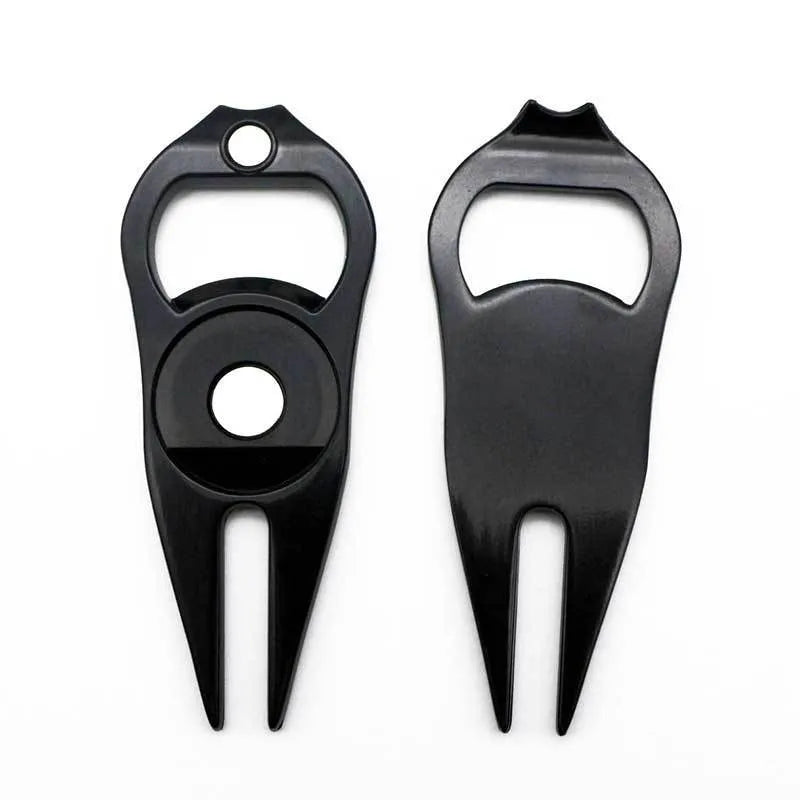 Black zinc alloy golf ball yoke and bottle opener tool with 25mm coin on putting green