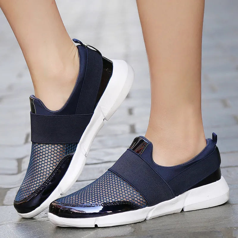Blue, black, and grey low-top women's sneakers with breathable mesh lining and lightweight PU midsole.