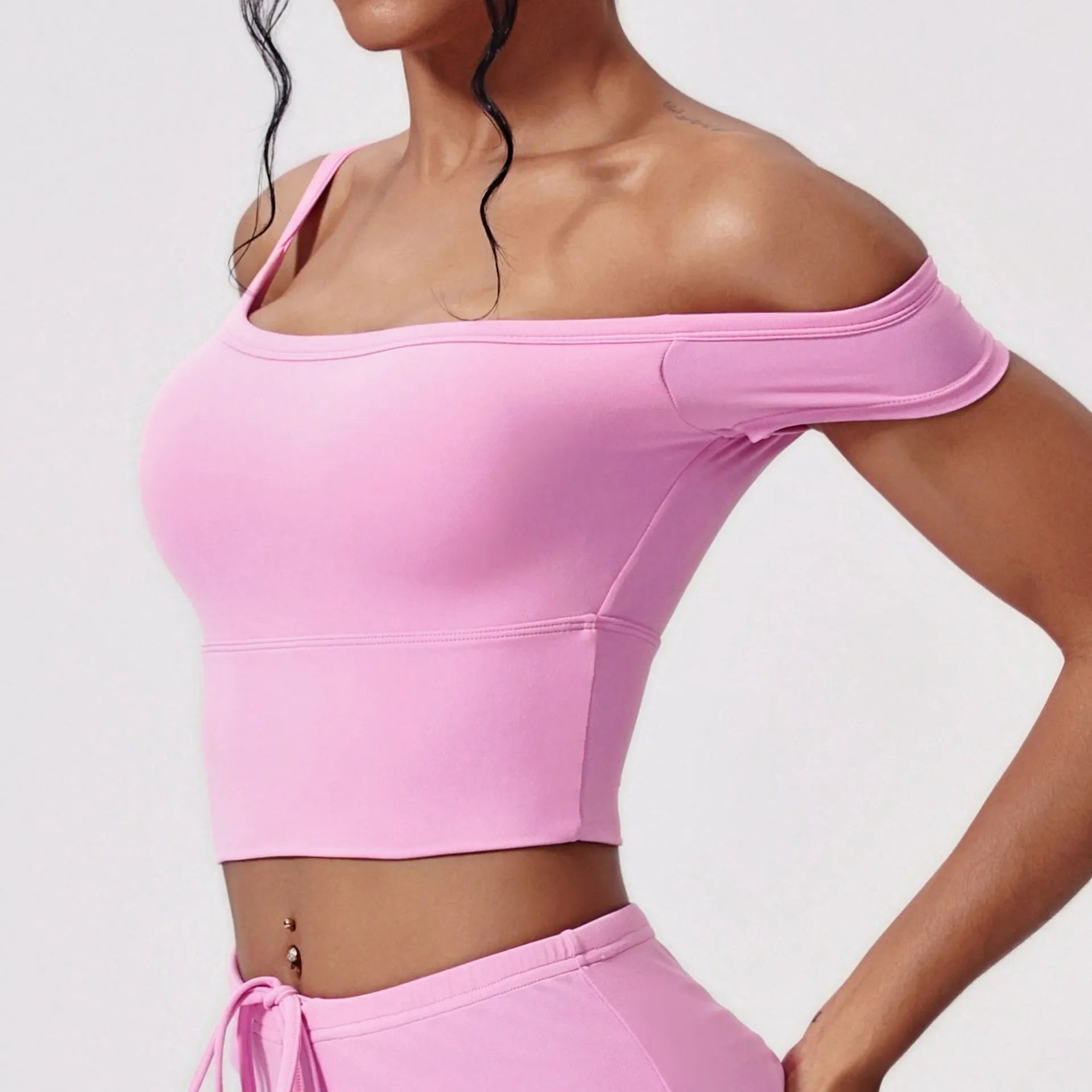 Asymmetric padded yoga vest in white with wireless full cup design and fixed double straps for women