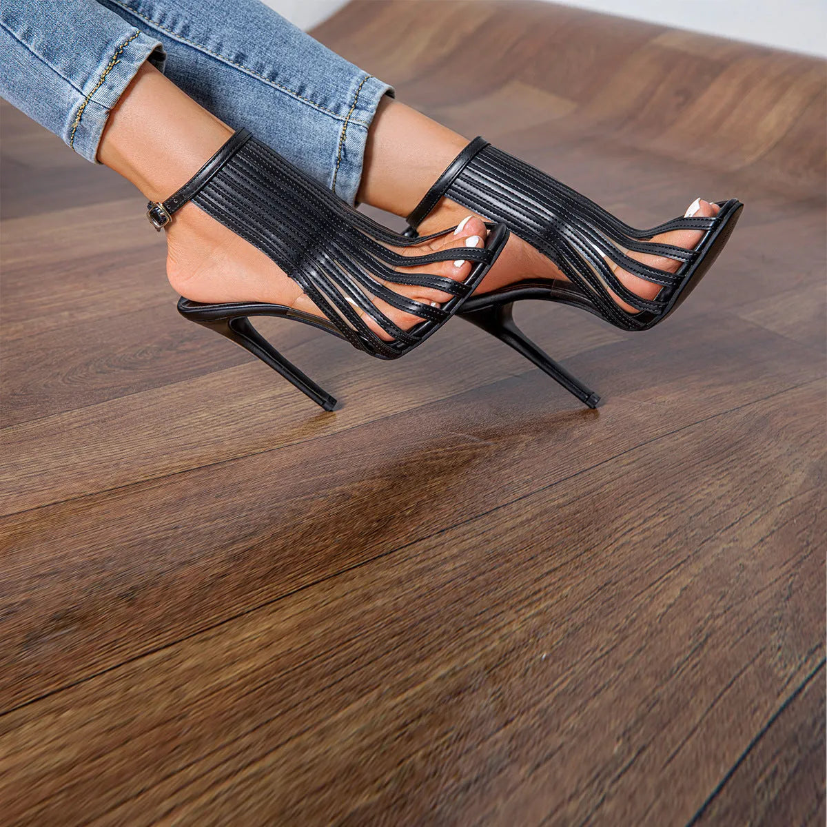 Ladies black PU stiletto heel open toe sandals with buckle fastening, Roman pointed toe style