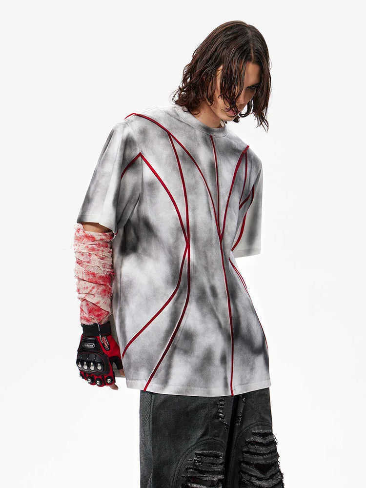 Short sleeve T-shirt with padded shoulders and textured line patchwork on a round neck.
