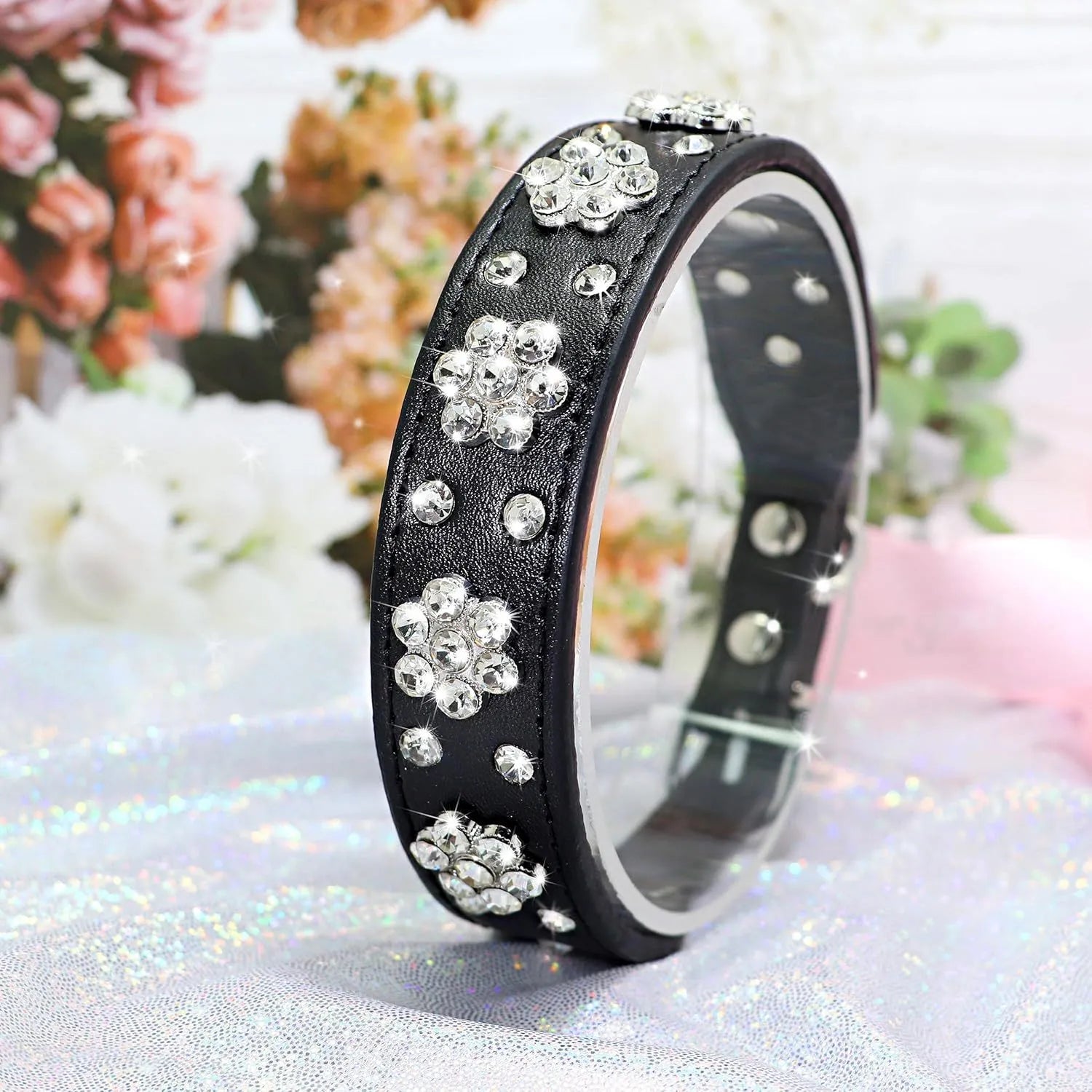 Soft black PU leather dog collar with a sparkling rhinestone flower pattern and metal adjustment buckle.