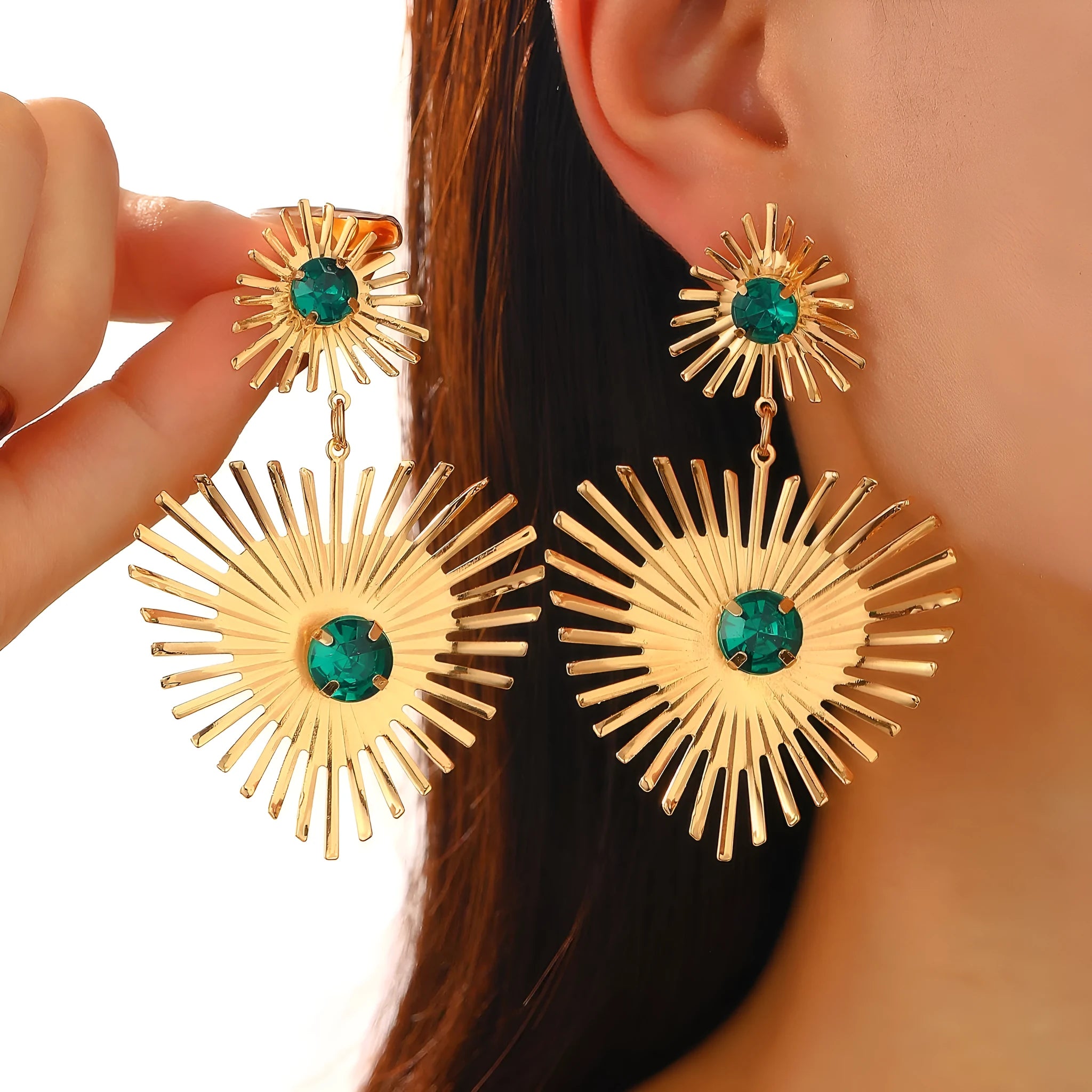 Alloy bohemian sunflower heart-shaped earrings with rhinestones in gold finish on white background