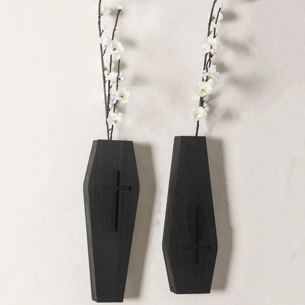 Black cross-shaped wooden wall vase shelf for decorative display measuring 27cm wide by 9cm tall