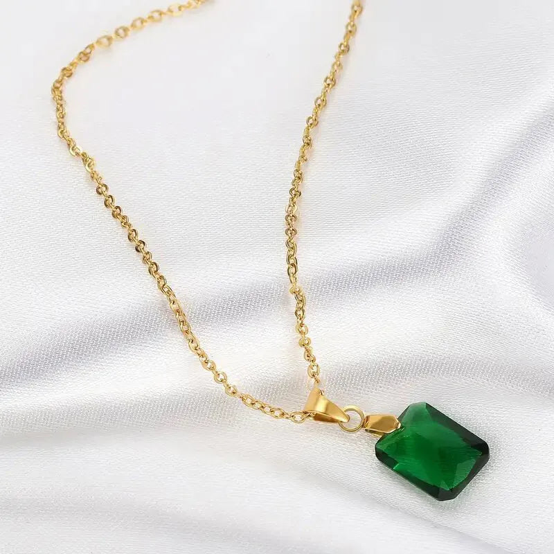 Rectangular geometric copper necklace with quadrilateral design on green background
