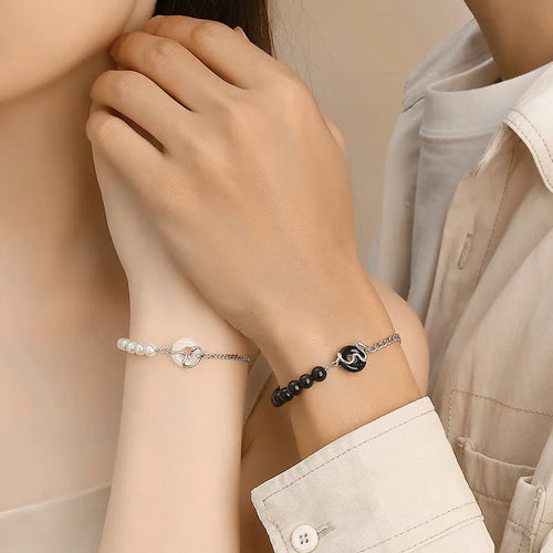 A pair of 925 sterling silver bracelets for men and women featuring a snake zodiac charm and a safety buckle clasp.
