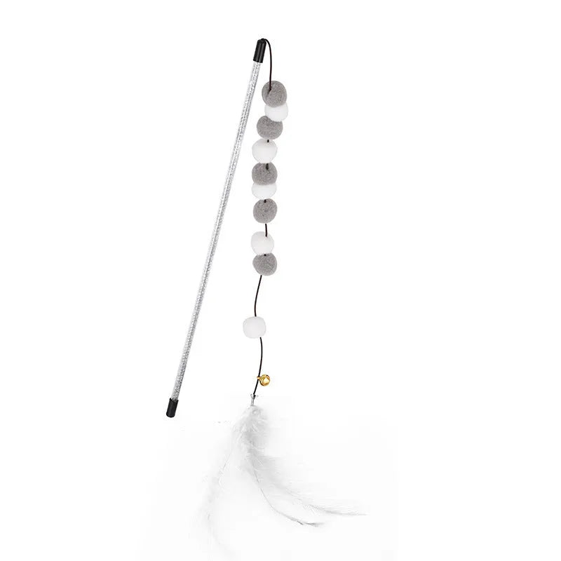 Colourful cat teaser toy rod with bell and pompon feather attachment on grey background