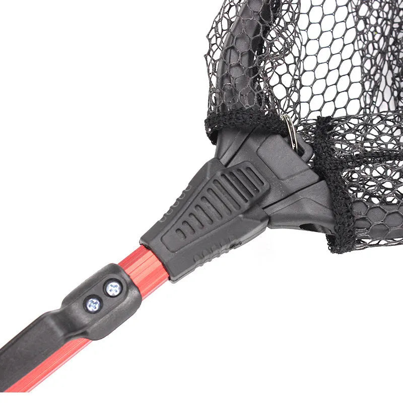 Red aluminium alloy triangular folding dip net collapsed to 47cm length on grass
