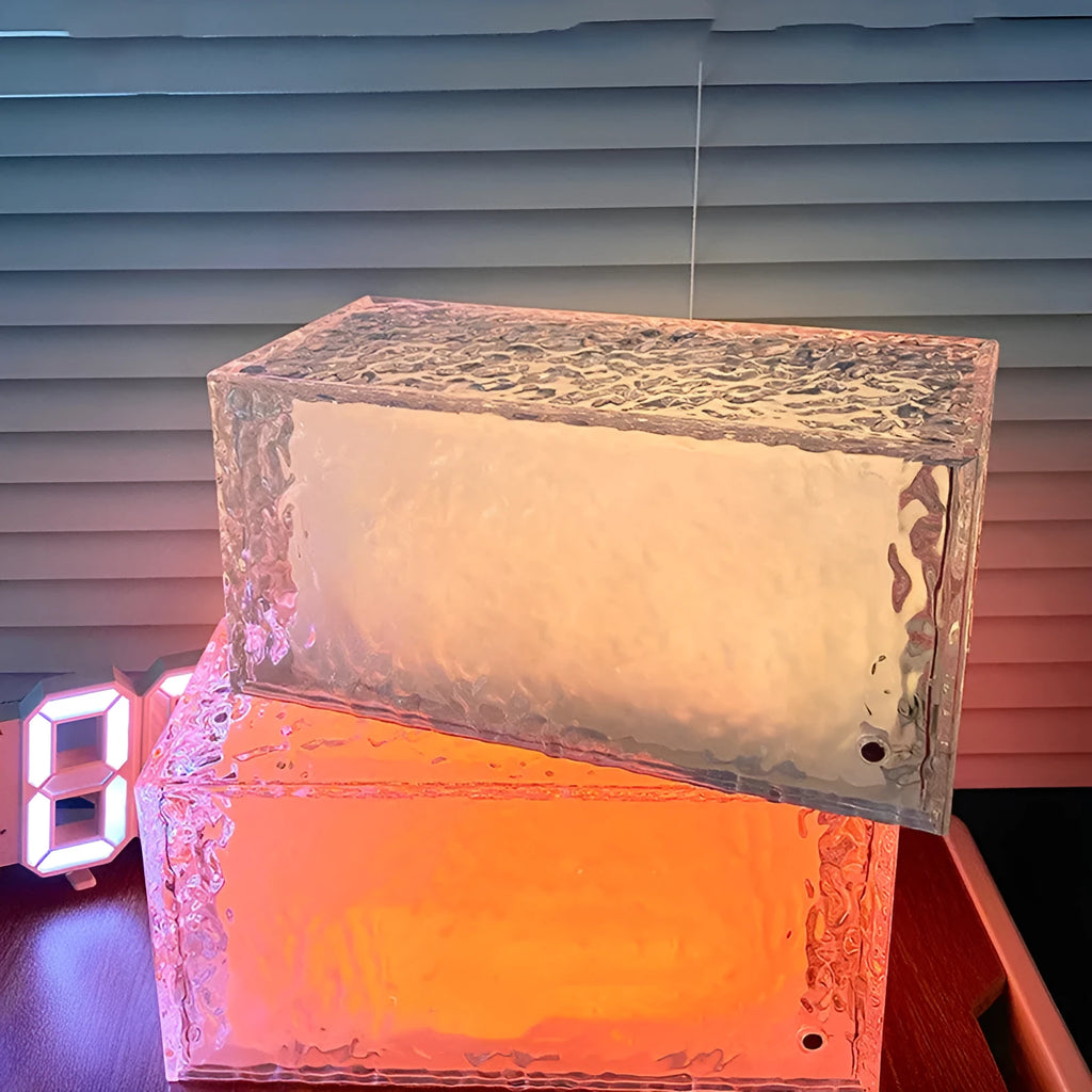 Geometric ice cube acrylic night lamp with multi-colour LED lighting on wooden surface