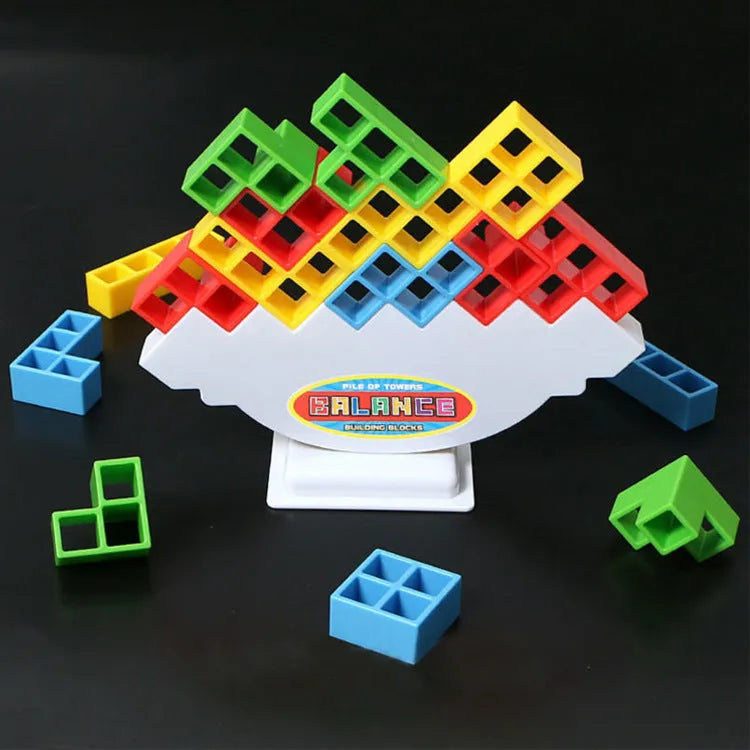 Plastic balance stacking game with 16 coloured building blocks on a chassis
