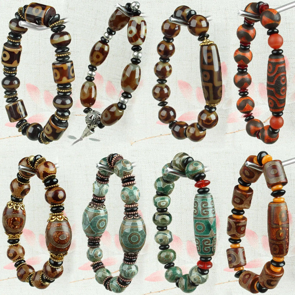 Distressed agate Tibet bead bracelet with three-eye motifs and multiple traditional bead styles on wrist