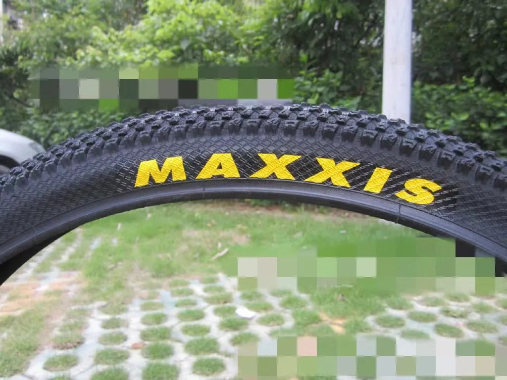Ultralight puncture-proof mountain bike tyre shown in multiple sizes including 26, 27.5 and 29-inch options.